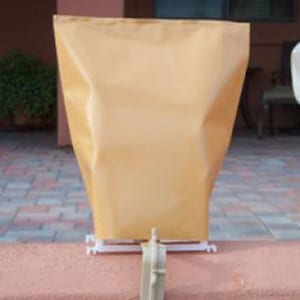 May include: A tan-colored pool cover with a white frame. The cover is made of a durable material and is designed to protect your pool from debris and the elements.