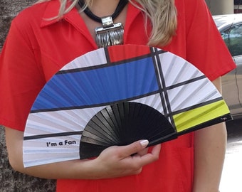 I'M A FAN: Mondrian inspired folding hand fan in bold red, blue, yellow colors with black wood ribs