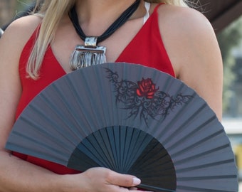 GOTHIC ROSE: Goth style folding hand fan - a red rose tattoo design on a black background with black wood ribs