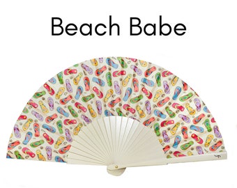 BEACH BABE: Pop Art flip flop design folding hand fan with cream colored wood ribs