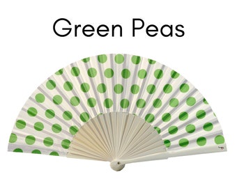 GREEN PEAS:  50s retro style folding hand fan with green polka dots on white background and white wood ribs