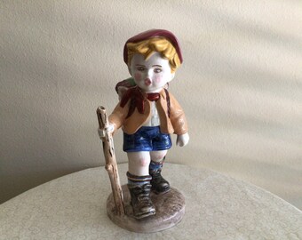 Vintage Boy with Walking Stick and Basket of Grapes Figurine