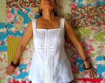 White Linen Camisole top with Pintucks and Lace trims, square neckline,  Hook and Eye fastening.