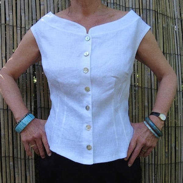 White Linen Sixties style Retro top is slim fitting and sleeveless with Boat neckline and natural pearl pearl buttons at front.