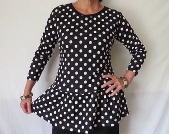 Black and White Polka dot Spotted top with Long sleeves and Peplum is  cute and warm to wear with pants or a skirt.