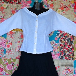 White Linen  Retro  top  with Boat neck, Pearl Buttons and Three Quarter sleeves is  also available in Black