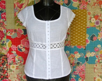 White Linen top with Lace trim, Short sleeves and Hook and Eye fastening is slim fitting and flattering shape.