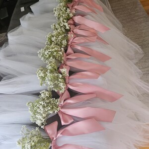 Mauve aisle decor for wedding. Babies breath.