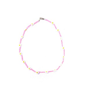 May include: A pink beaded necklace with white daisy flowers. The necklace is made of small pink beads and has white daisy flowers with yellow centers.