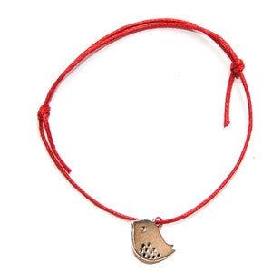 silver bird charm on waxed cotton cord adjustable friendship bracelet