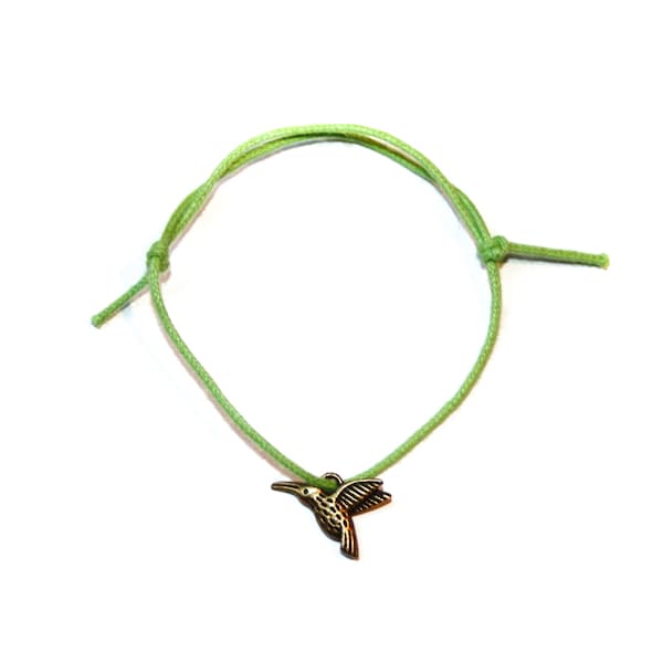 charme d’oiseau de bourdonnement de bronze sur le bracelet d’amitié réglable de cordon de coton ciré