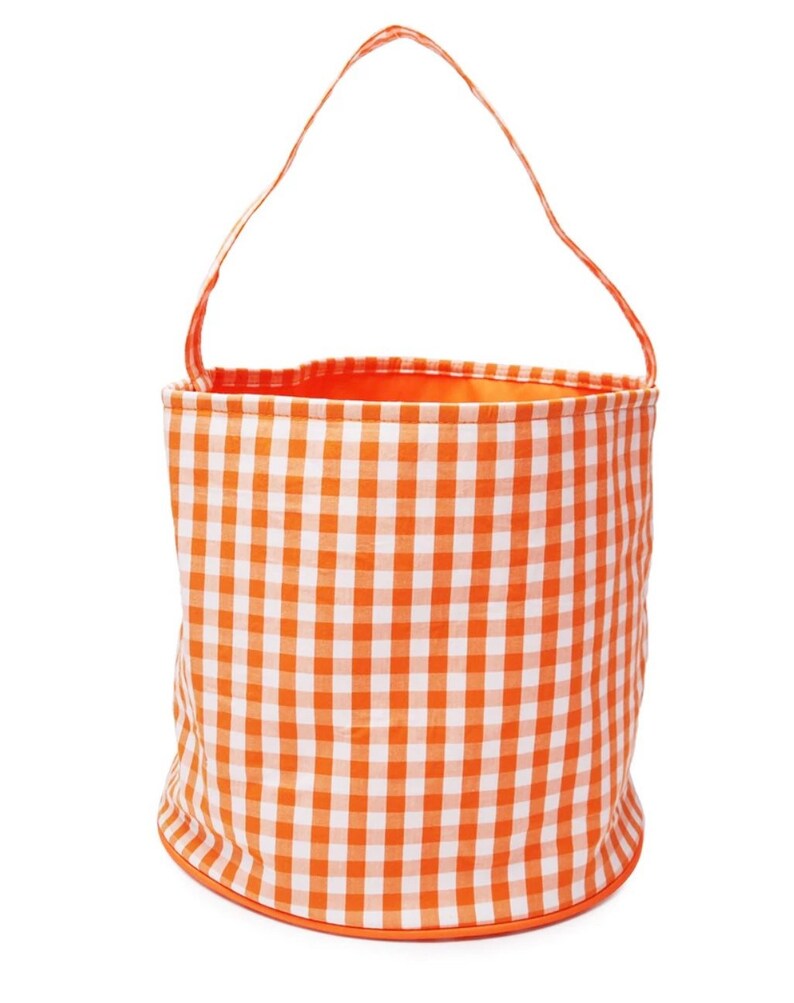 May include: Orange and white gingham fabric bucket with a handle. The bucket is made of fabric and has a gingham pattern.