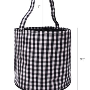 May include: Black and white checkered fabric bucket with a black handle. The bucket is 9.5 inches tall, 10 inches wide, and the handle is 7 inches long.