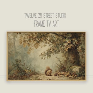 May include: A framed landscape painting featuring a squirrel eating nuts near a large tree. The artwork has a vintage aesthetic with muted greens, browns, and golds. The text "TWELVE 28 STREET STUDIO FRAME TV ART" is at the top.