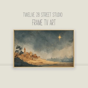 以下が含まれることがあります： 星空の下の村の風景を描いた、額装された水彩画。 暖色系の色使いで、目立つ星が特徴です。 上部には「TWELVE 28 STREET STUDIO FRAME TV ART」というテキストが表示されています。