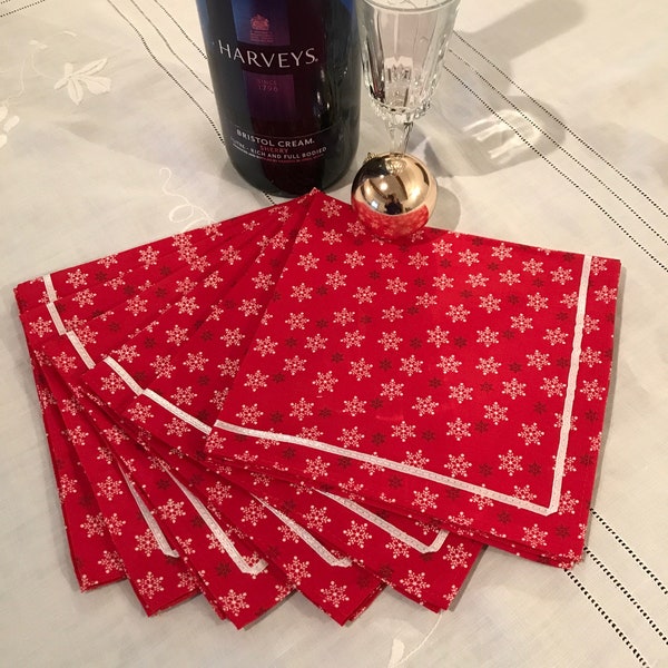 Set of six cotton fabric Christmas napkins with ribbon trim red snowflakes