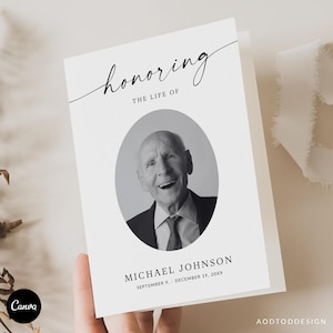 May include: A memorial card with the text "honoring the life of" above a black and white oval portrait of a smiling older man. The name "MICHAEL JOHNSON" and dates are below the portrait. The Canva logo is in the lower left corner.