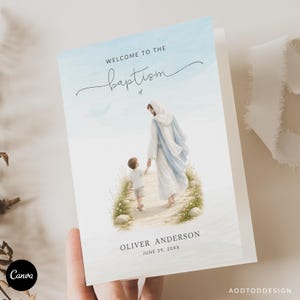 May include: A rectangular baptism invitation card featuring a watercolor illustration of a figure in white and blue robes walking with a young child on a path. The text reads Welcome to the baptism, Oliver Anderson, and June 29, 20XX.