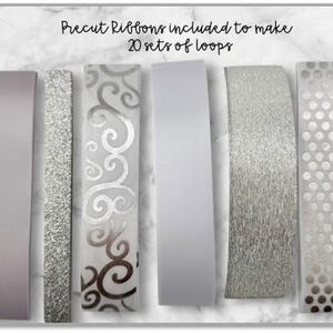 May include: Precut ribbons in various designs, including solid, glitter, and patterned styles. The ribbons are in shades of silver and white, with the text "Precut Ribbons included to make 20 sets of loops".