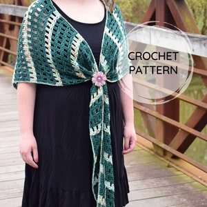 May include: A green and white crochet shawl with a floral accent. The shawl is tied around the neck and drapes down the front of the body. The text "CROCHET PATTERN" is written in a circle on the image.