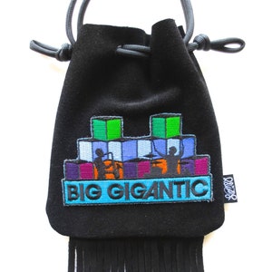 May include: Black velvet drawstring bag with a colorful embroidered design featuring a stacked block pattern and the text "BIG GIGANTIC". The bag has a black fringe.