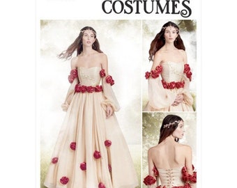 May include: Simplicity Costumes pattern S9577 for a princess costume. The pattern includes a strapless gown with a fitted bodice and a full skirt, long sleeves with a gathered cuff, and a decorative rose detail. The gown is shown in a light beige color with red roses.