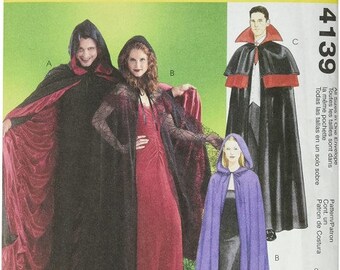 May include: McCall's Costumes sewing pattern for a vampire costume. The pattern includes three different styles of capes: a red velvet cape, a black velvet cape, and a purple velvet cape. The pattern is easy to sew and can be completed in two hours.