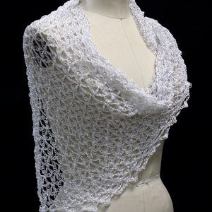 White wedding shawl draped on a dress-form mannequin, front three-quarter view of the delicate wrap.