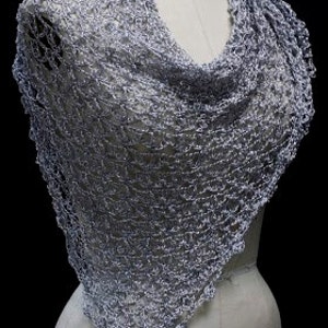 Front view of the silver-white shawl wrapped around the mannequin's shoulders.