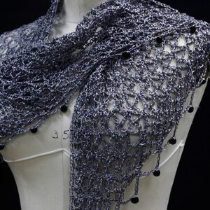 Grey shawl on the mannequin, alternate front angle showing the openwork and bead trim.