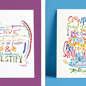 May include: Two colorful art prints with inspirational quotes. The first print features a rainbow circle with the text "There is a peace. There is a LOVE you can get lost inside. Come to the fountain & let me assure you, TESTIFY." The second print features a rainbow design with the text "God of MERCY Sweet Love of mine I have surrendered to YOUR DESIGN May these offerings stretch across the skies and these HALLELUJAHs be Multiplied."