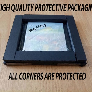 May include: A close-up of a painting protected by black foam padding. The foam is wrapped around the edges of the painting, and the text "NataShRay" is visible on the painting. The text "HIGH QUALITY PROTECTIVE PACKAGING" is at the top of the image, and the text "ALL CORNERS ARE PROTECTED" is at the bottom of the image.