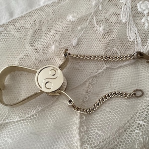 Vintage sweater clip, holder