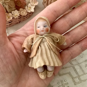 German Antique Bisque Hertwig Candy Baby Doll 2 3/4 Inches With Original Clothing