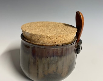Black jar with cork and spoon