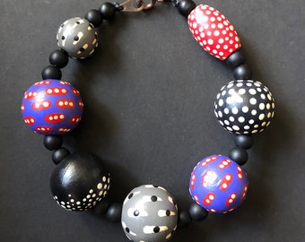 Painted Dots Bracelet, Wooden Beads with Eyes and Dotted Patterns, Black Purple Gray Red