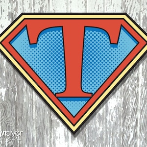 May include: A red letter "T" in a yellow and red Superman logo with a blue background and a white polka dot pattern.
