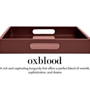 May include: A rectangular oxblood-colored tray with integrated handles on the sides. Below the tray, the text reads: oxblood. A rich and captivating burgundy that offers a perfect blend of warmth, sophistication, and drama.