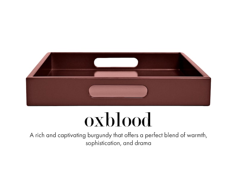 May include: A rectangular oxblood-colored tray with integrated handles on the sides. Below the tray, the text reads: oxblood. A rich and captivating burgundy that offers a perfect blend of warmth, sophistication, and drama.