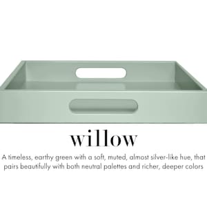 May include: A rectangular sage green serving tray with integrated cutout handles on the sides. Below the tray, the text reads: willow. A timeless, earthy green with a soft, muted, almost silver-like hue, that pairs beautifully with both neutral palettes and richer, deeper colors.