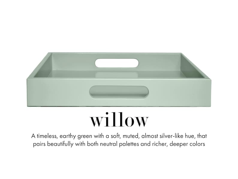 May include: A rectangular sage green serving tray with integrated cutout handles on the sides. Below the tray, the text reads: willow. A timeless, earthy green with a soft, muted, almost silver-like hue, that pairs beautifully with both neutral palettes and richer, deeper colors.