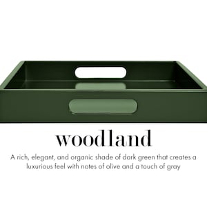 May include: A rectangular dark green serving tray with integrated handles on the sides. The text "woodland" is printed below the tray, followed by the description: "A rich, elegant, and organic shade of dark green that creates a luxurious feel with notes of olive and a touch of gray."
