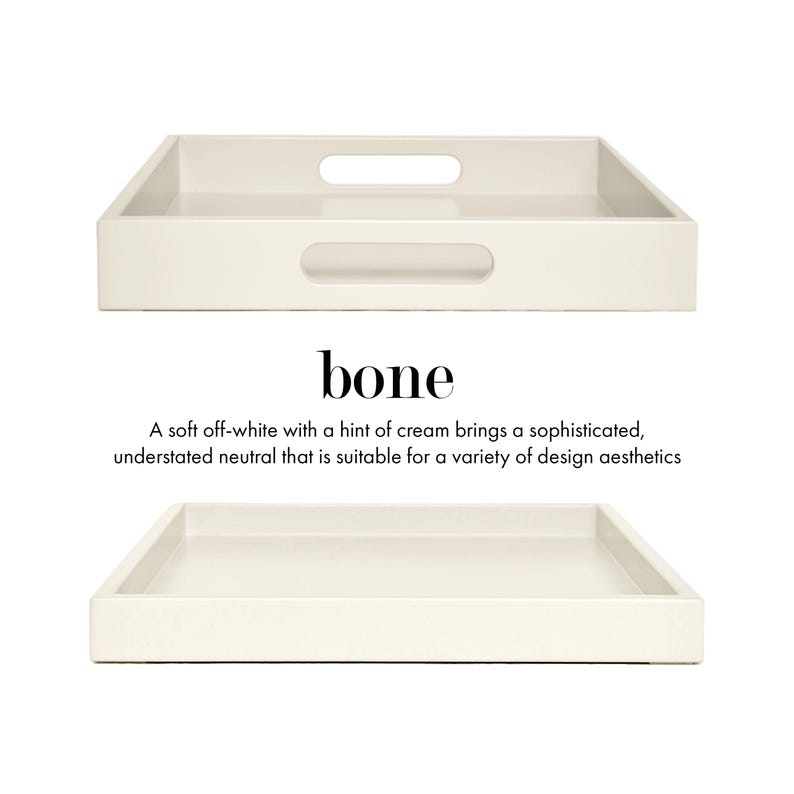 May include: A rectangular off-white tray with a smooth finish and cut-out handles on the sides. The text bone is printed in black above a description that reads: A soft off-white with a hint of cream brings a sophisticated, understated neutral that is suitable for a variety of design aesthetics.
