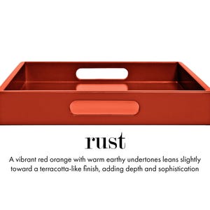 May include: A rectangular tray in a rust red-orange color with a smooth finish. The tray features integrated cutout handles on the sides. Below the tray, the text reads: rust. A vibrant red orange with warm earthy undertones leans slightly toward a terracotta-like finish, adding depth and sophistication.