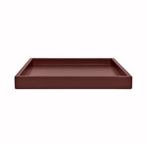 May include: A square, burgundy-colored tray with a raised edge. The tray is made of a solid material and has a smooth, matte finish. The tray is designed for serving or displaying items.
