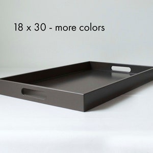 May include: A dark gray rectangular serving tray with two handles. The tray measures 18 x 30 inches.  18 x 30 - more colors