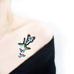 blue flying butterflies temporary tattoo pieced on chest