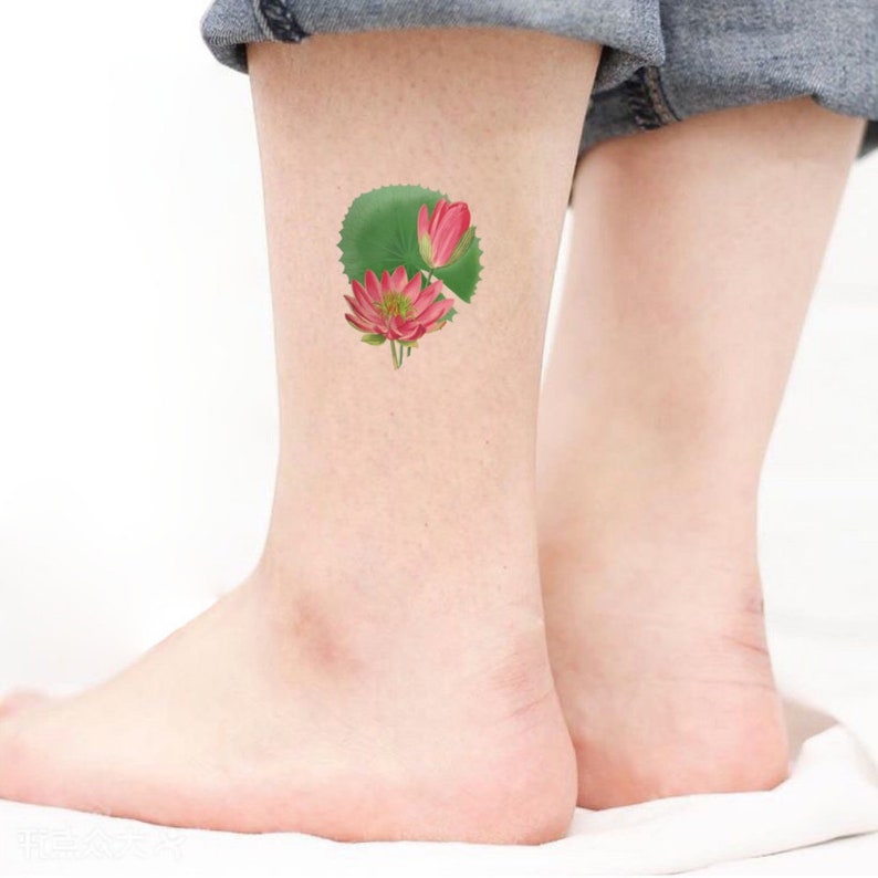 pink lotus tattoo pieced on ankle
