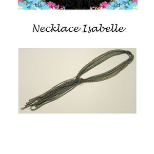 May include: A multi-strand necklace with a knotted design, featuring a cascade of small, dark grey beads. The necklace is labelled "Necklace Isabelle" and is displayed on a white background.
