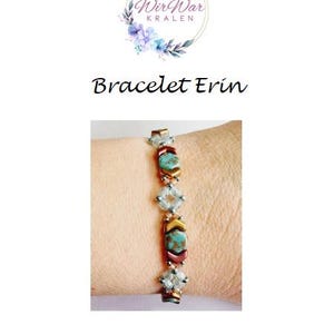 May include: A turquoise, gold, and copper beaded bracelet with a geometric pattern. The bracelet is on a person's wrist.